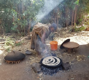 Woman baking Enjera - the Ethiopian national bread