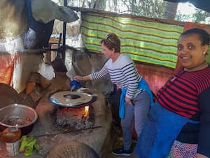 Visitor trying to bake Enjera bread in Addis Ababa