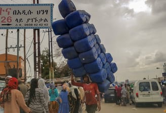 Merkato Market - Man carrying empty jerrycans