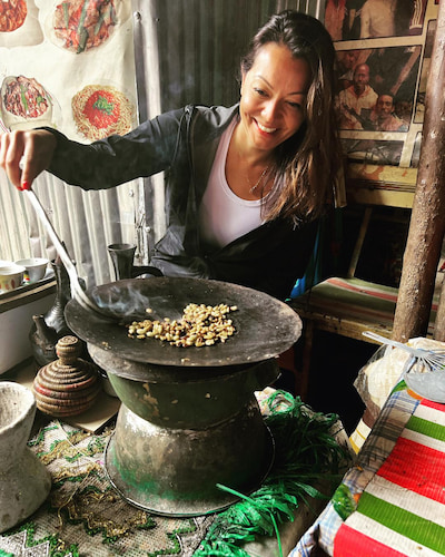 Tourist trying to roast coffee beans in Addis Ababa